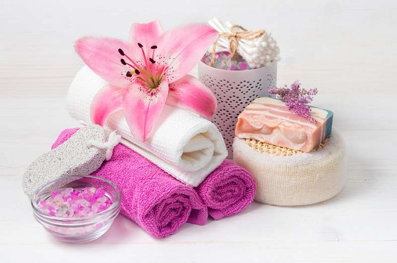 massage towels soap and flower